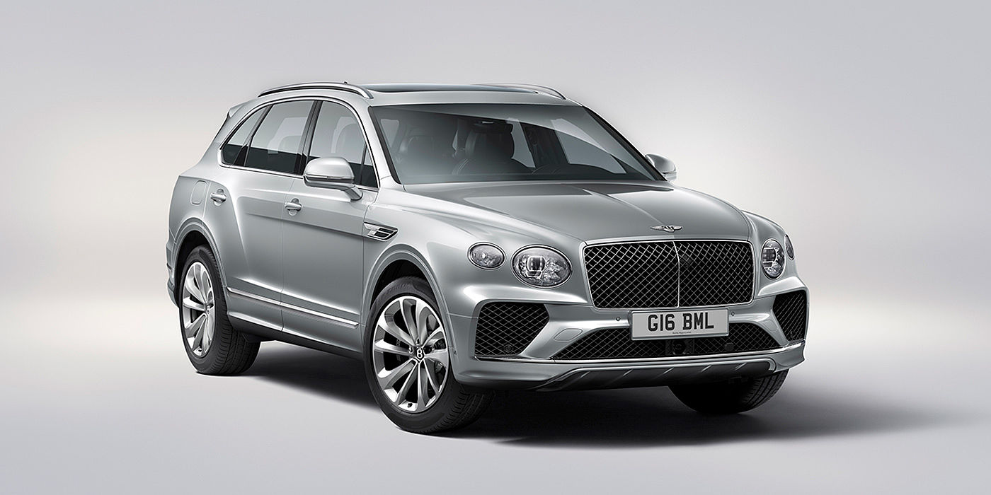 Bentley Padova Bentley Bentayga in Moonbeam paint, front three-quarter view, featuring a matrix grille and elliptical LED headlights.