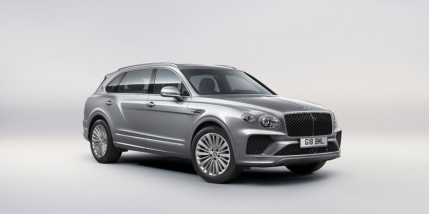 Bentley Padova Bentley Bentayga Extended Wheelbase luxury SUV front three quarter view in Moonbeam paint with 21 inch five spoke painted wheels