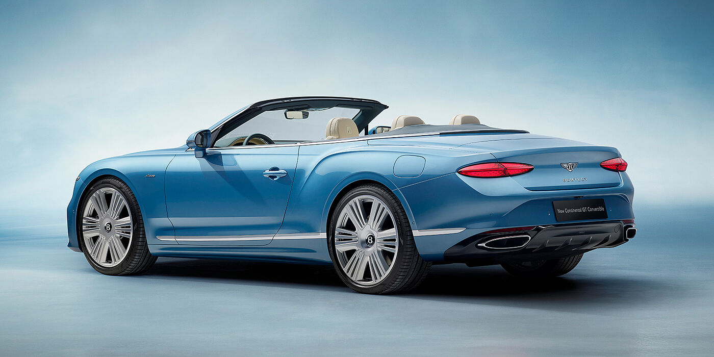 Bentley Padova New Bentley Continental GTC Azure convertible rear view in Light Windsor blue paint with 22 inch ten spoke wheels and chrome exterior details