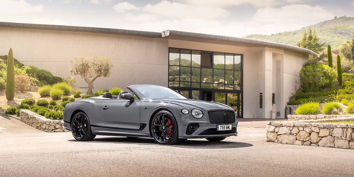 Bentley Padova Bentley Continental GTC S convertible in Cambrian Grey paint front 34 static near house