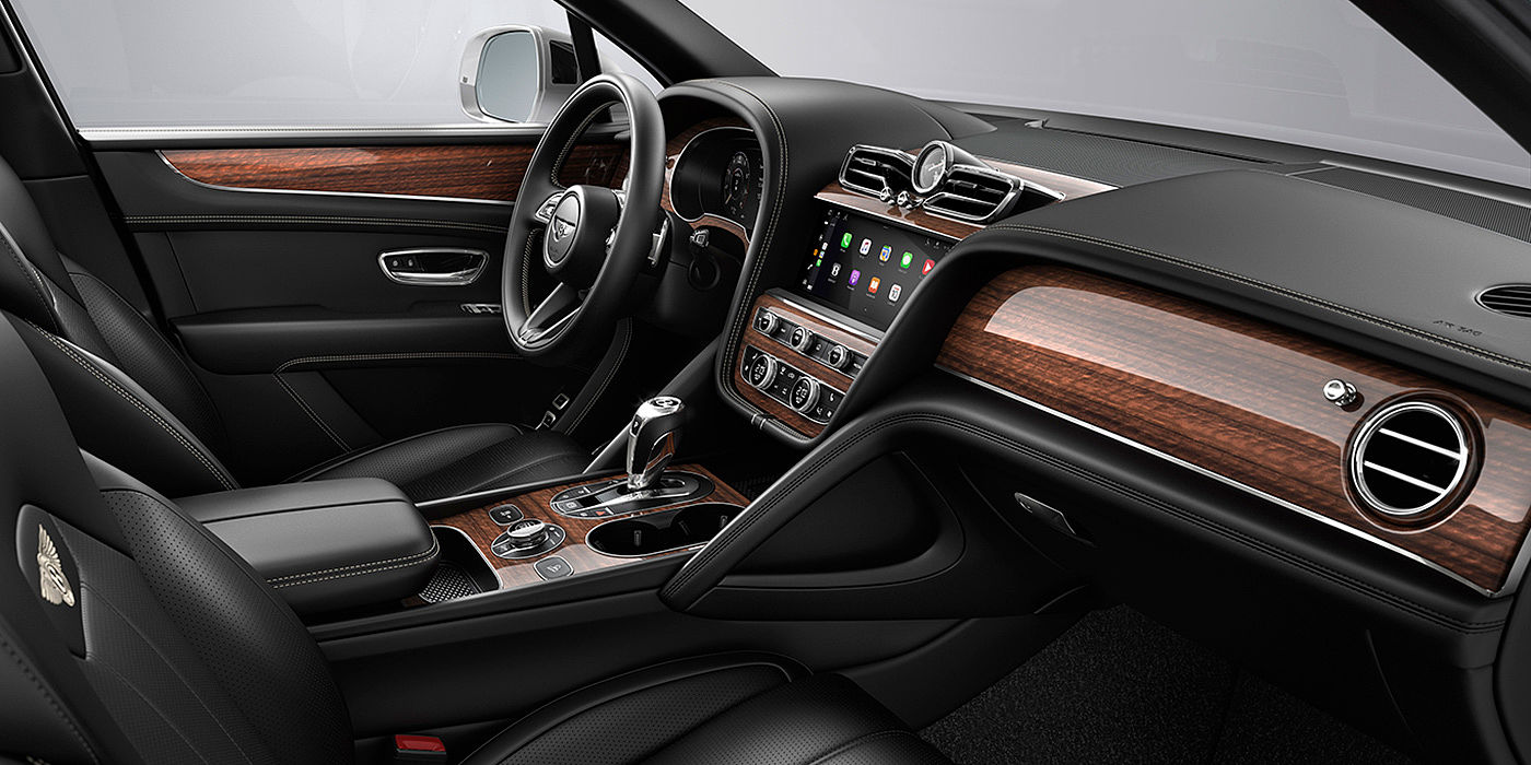 Bentley Padova Bentley Bentayga interior with a Crown Cut Walnut veneer, view from the passenger seat over looking the driver's seat.