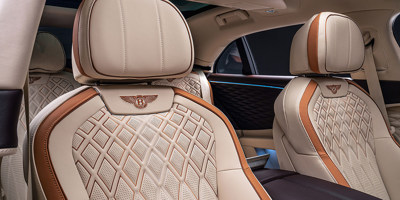 Bentley Padova Bentley Flying Spur Odyssean sedan rear seat detail with Diamond quilting and Linen and Burnt Oak hides