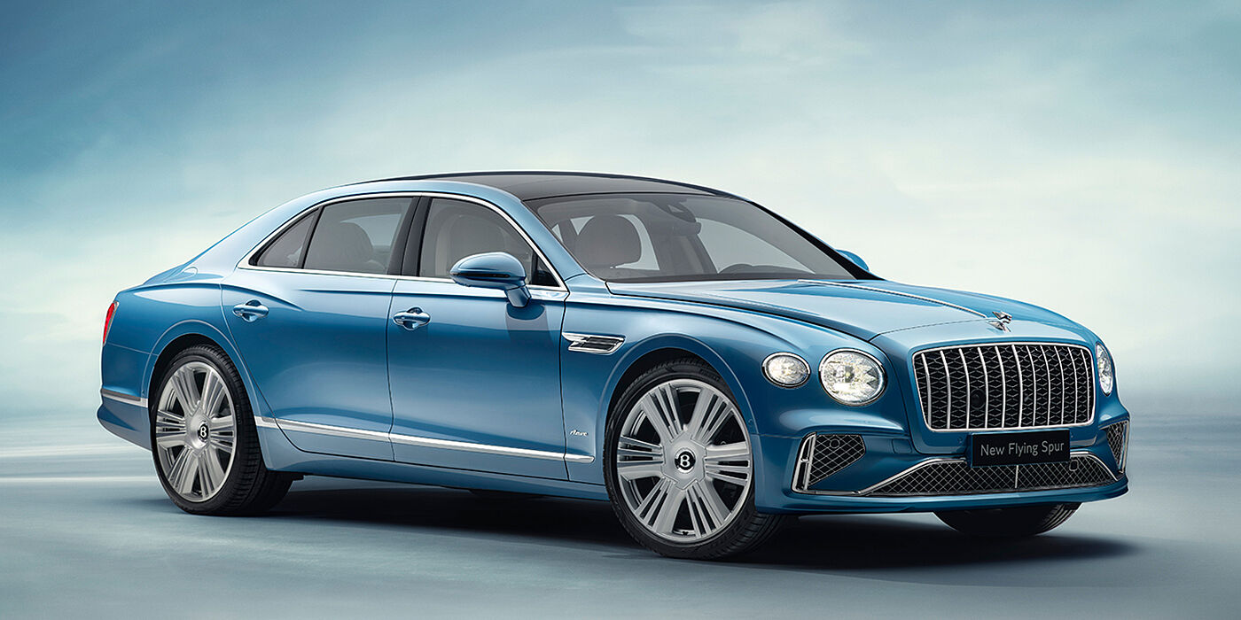 Bentley Padova New Bentley Flying Spur Azure sedan front view in Light windsor blue by Mulliner paint with 22 inch Azure wheels and chrome exterior details