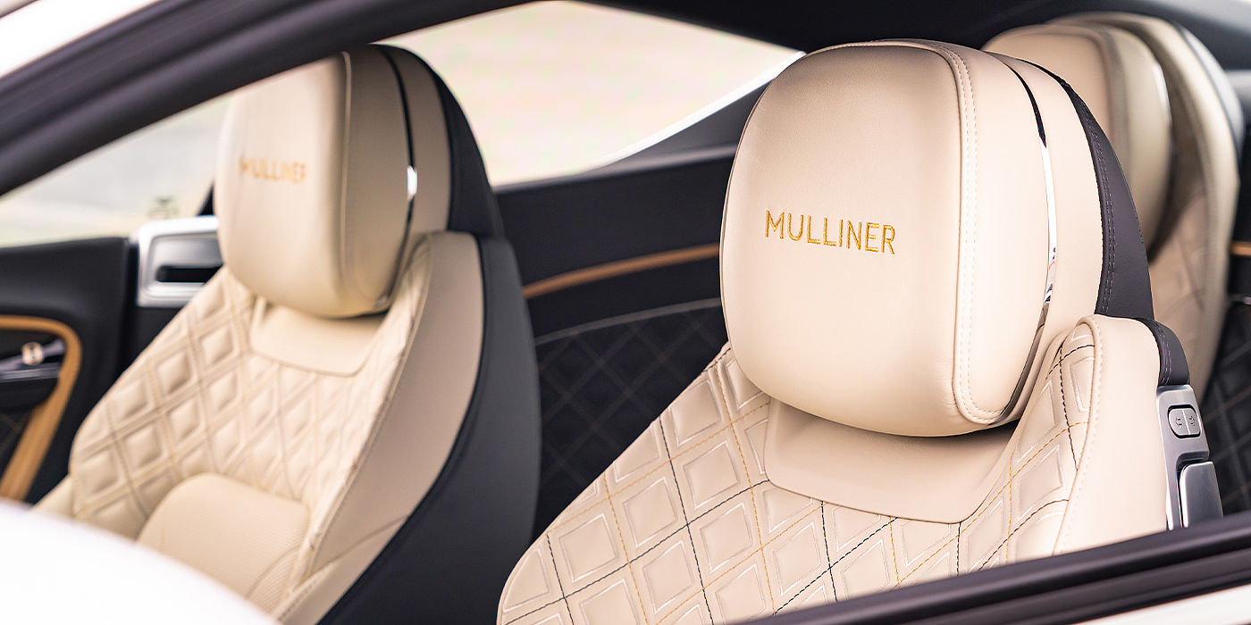 Bentley Padova Bentley Continental GT Mulliner coupe seat detail in Beluga black and Linen hide