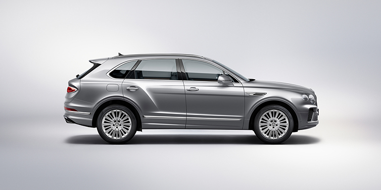 Bentley Padova Bentley Bentayga SUV side profile in Moonbeam silver paint against white background featuring 21 inch 5 spoke wheels