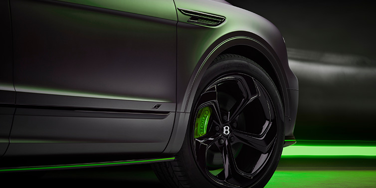 Bentley Padova Bentley Bentayga S Black Edition SUV exterior wheel detail with Cyber Green brakes with Anthracite Satin paint