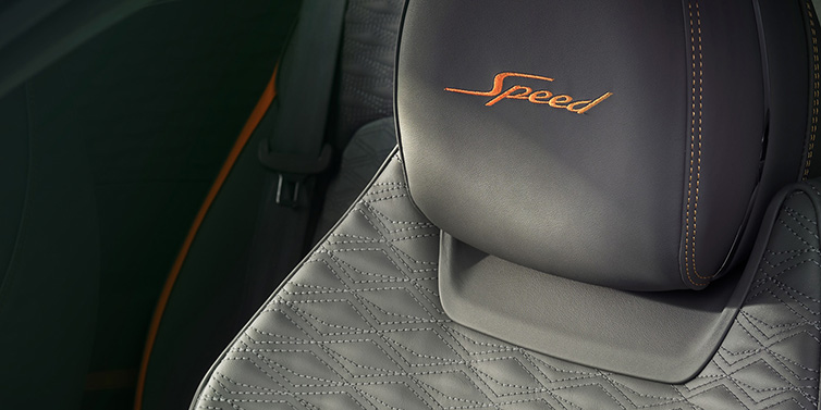 Bentley Padova Bentley Continental GT Speed coupe seat detail in Gravity Grey hide and Speed emblem in Mandarin by Mulliner coloured embroidery