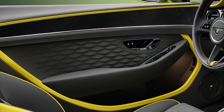 Bentley Padova Bentley Continental GTC Speed convertible interior door details featuring Gravity Grey and Cyber Yellow by Mulliner hides and high gloss carbon fibre veneer